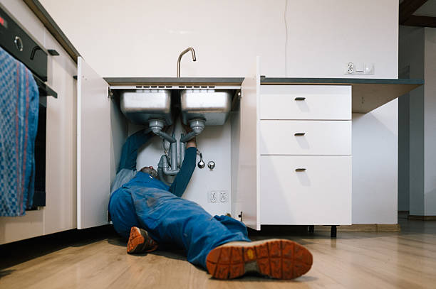 Professional Emergency Plumber technician working in Lowell, AR